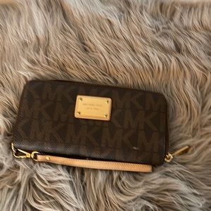 Michael kors brown wallet still in good condition.